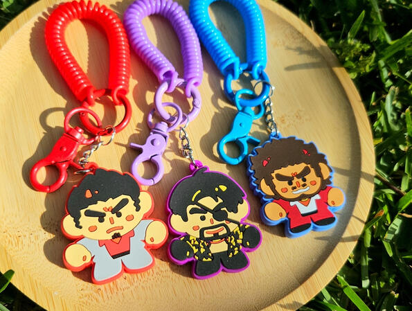 PVC rubber keychain wristlets of Kiryu, Majima, and Ichiban from Yakuza.