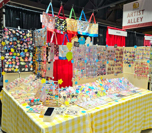 8x6ft booth at Anime Los Angeles 2025. This is an example of how I would arrange a corner space.