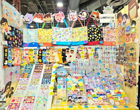 6ft table at Anime Expo 2025. This is generally the type of display I would do at most Artist Alleys.