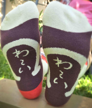 Bottom detail of the Goldship socks, inspired by her victory pose where she says "Wai wai~!" while kicking down her trainer.